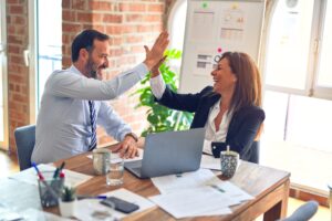 Real estate agents celebrate a deal closure 